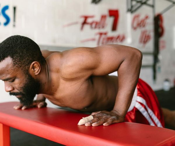 Focused man doing a challenging bodyweight exercise.